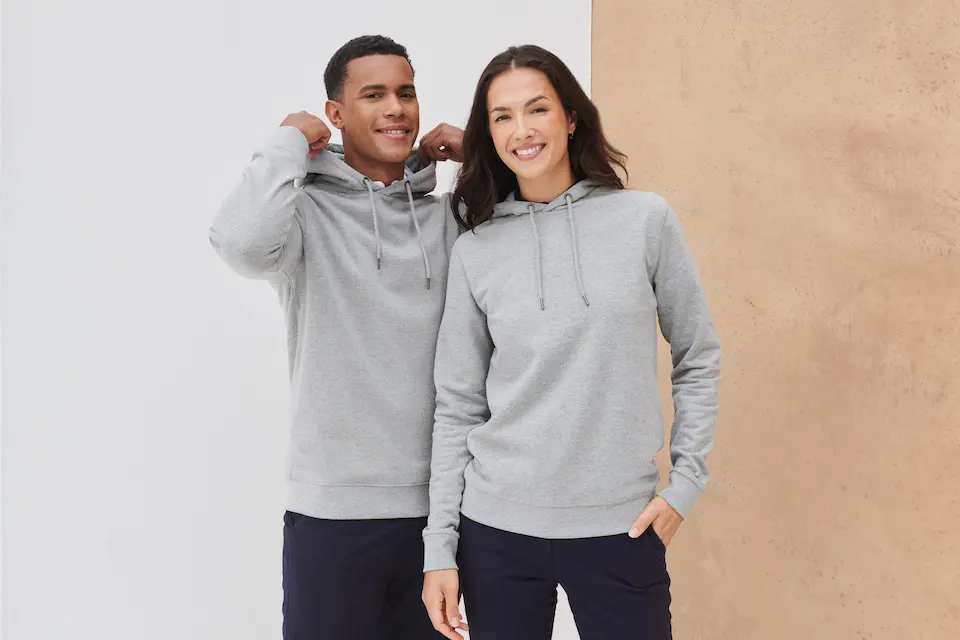 young man and woman in grey hoodies