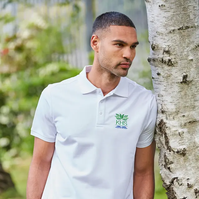 young man wearing corporate branded polo shirt